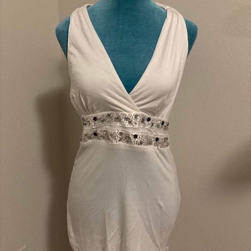 White bodycon dress with silver sequin belt and tie back detail